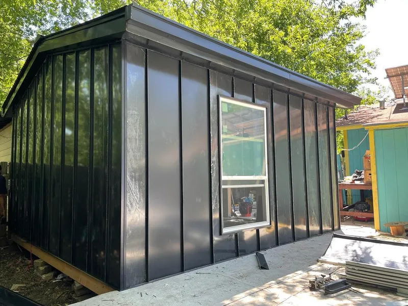 Black standing seam metal wall panels for Roof Inspection in Roxboro